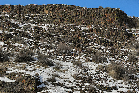 Basalt Cliff With Snow